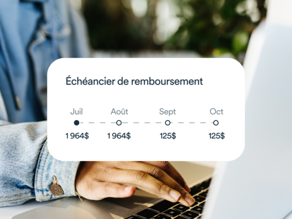 Un homme utilisant son ordinateur portable