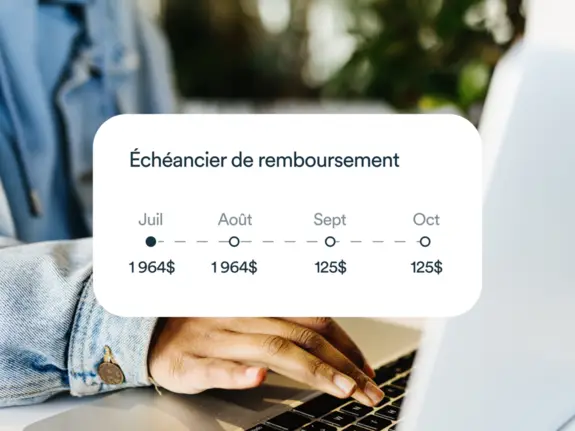 Un homme utilisant son ordinateur portable